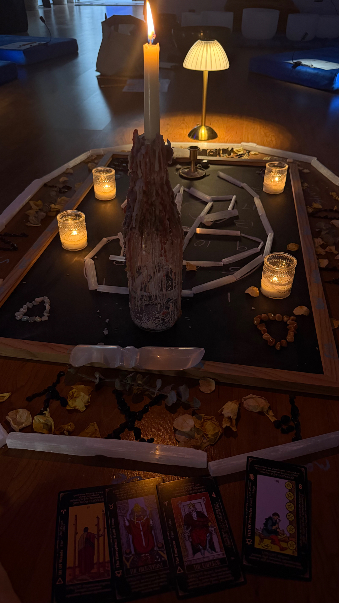 Candlelit altar with crystals, selenite and tarot